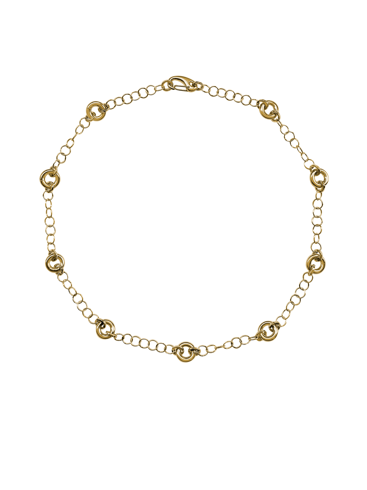 The Astra Necklace, a delicate cable chain with circular link accents in gold.