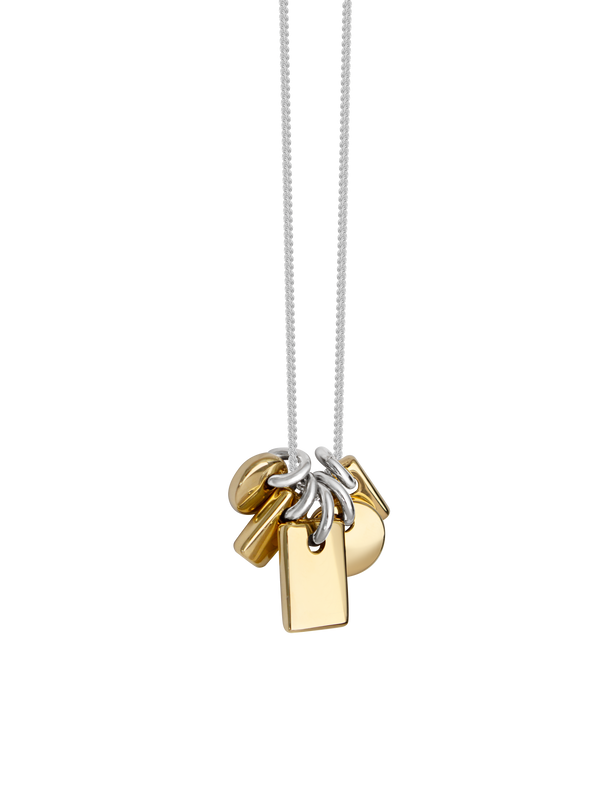 Necklace with gold and silver pendants on a sterling silver chain overtop a neutral background.