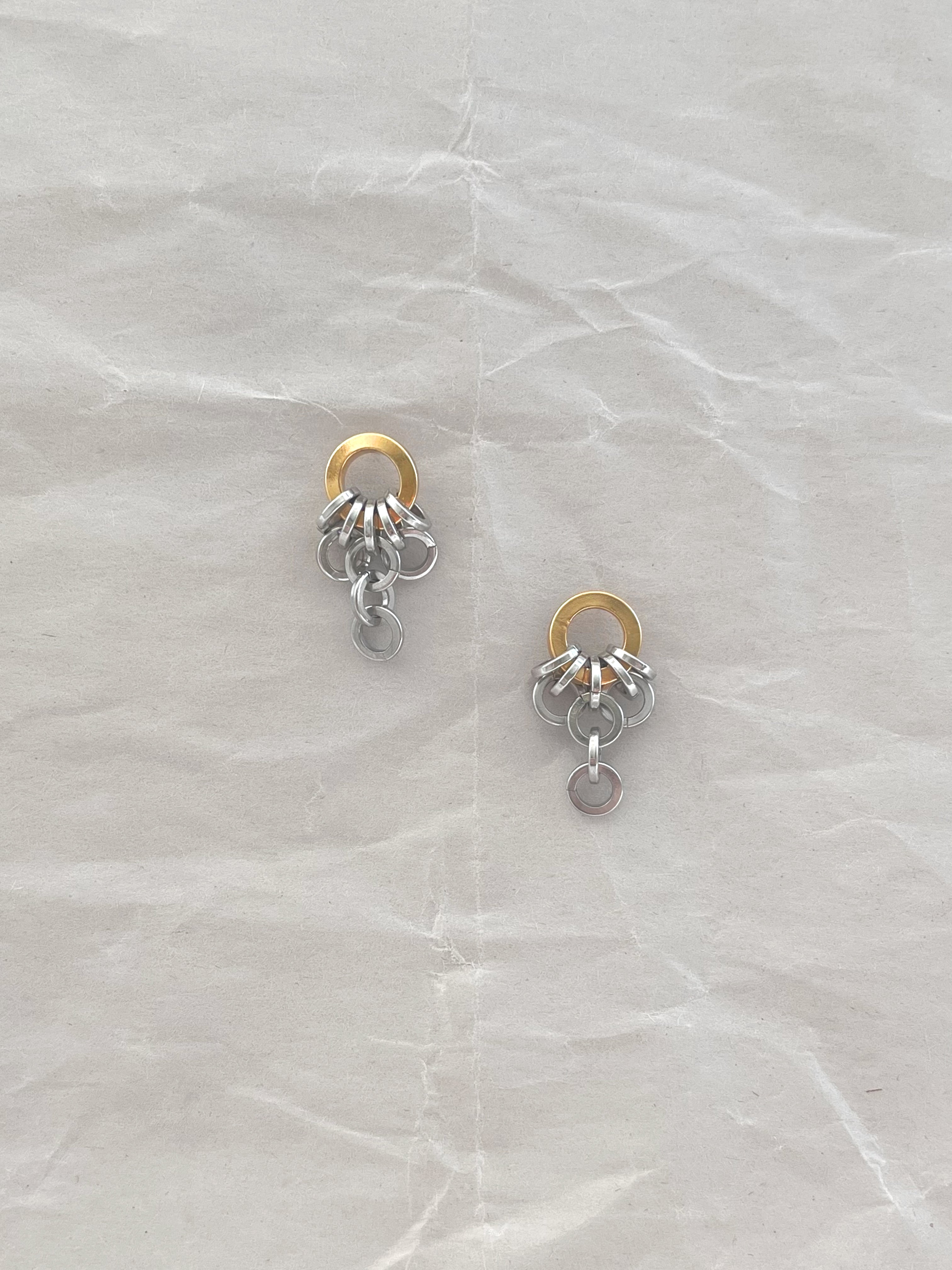 Laura Lombardi Two Tone Colonna drop earrings on a white paper background.