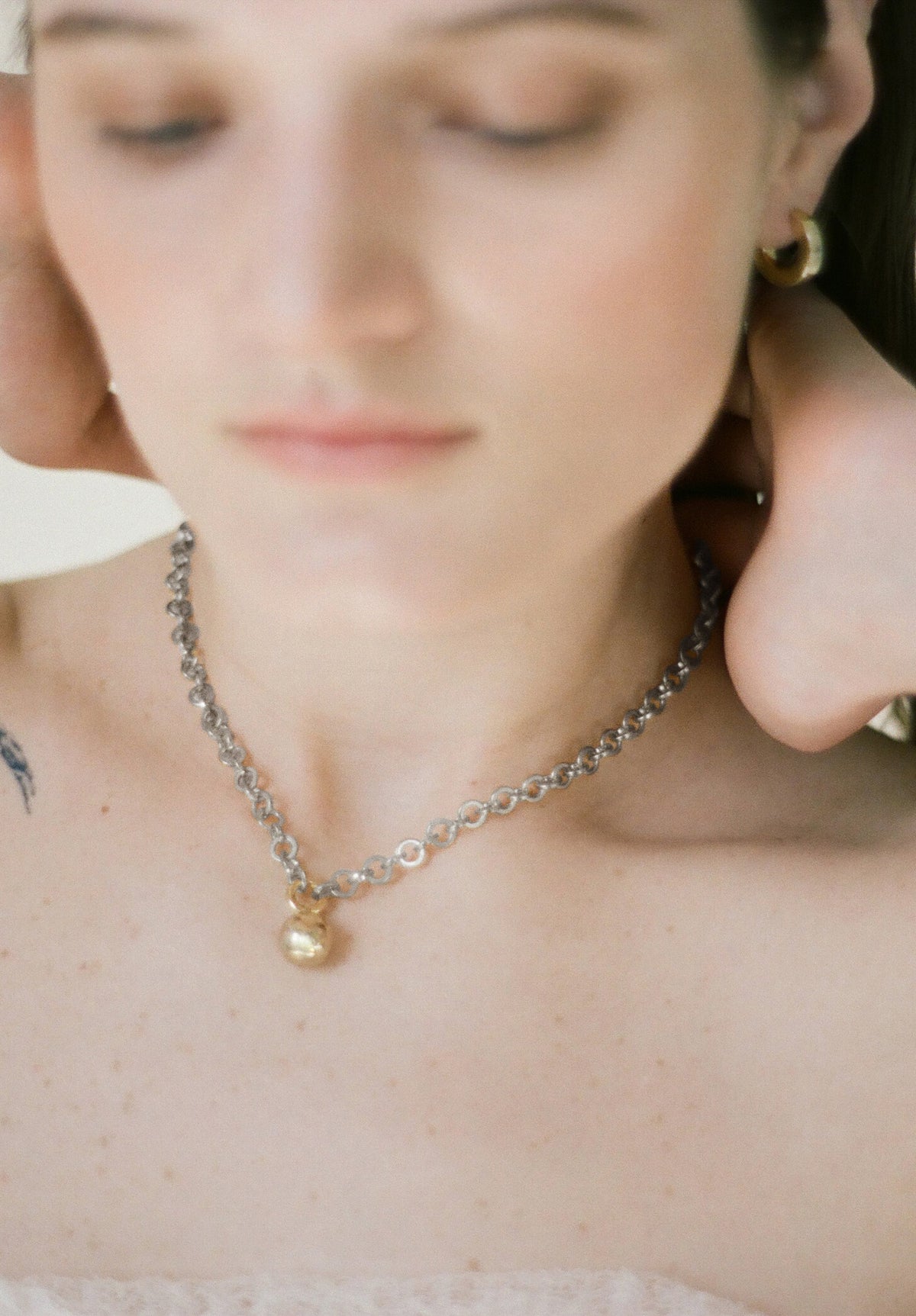Model wearing Laura Lombardi Two Tone Campana Necklace