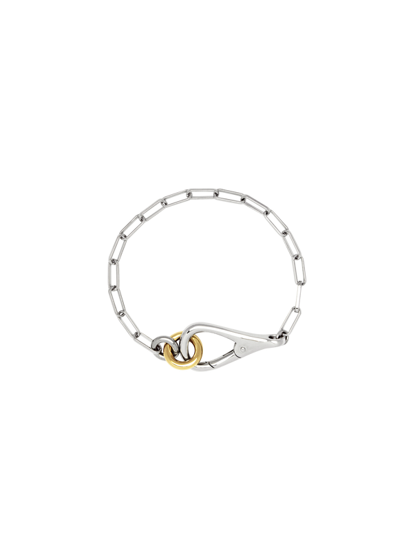 Two Tone Frena Bracelet, a silver-toned chain bracelet with a silver toggle clasp and gold jump ring, displayed on a neutral background.