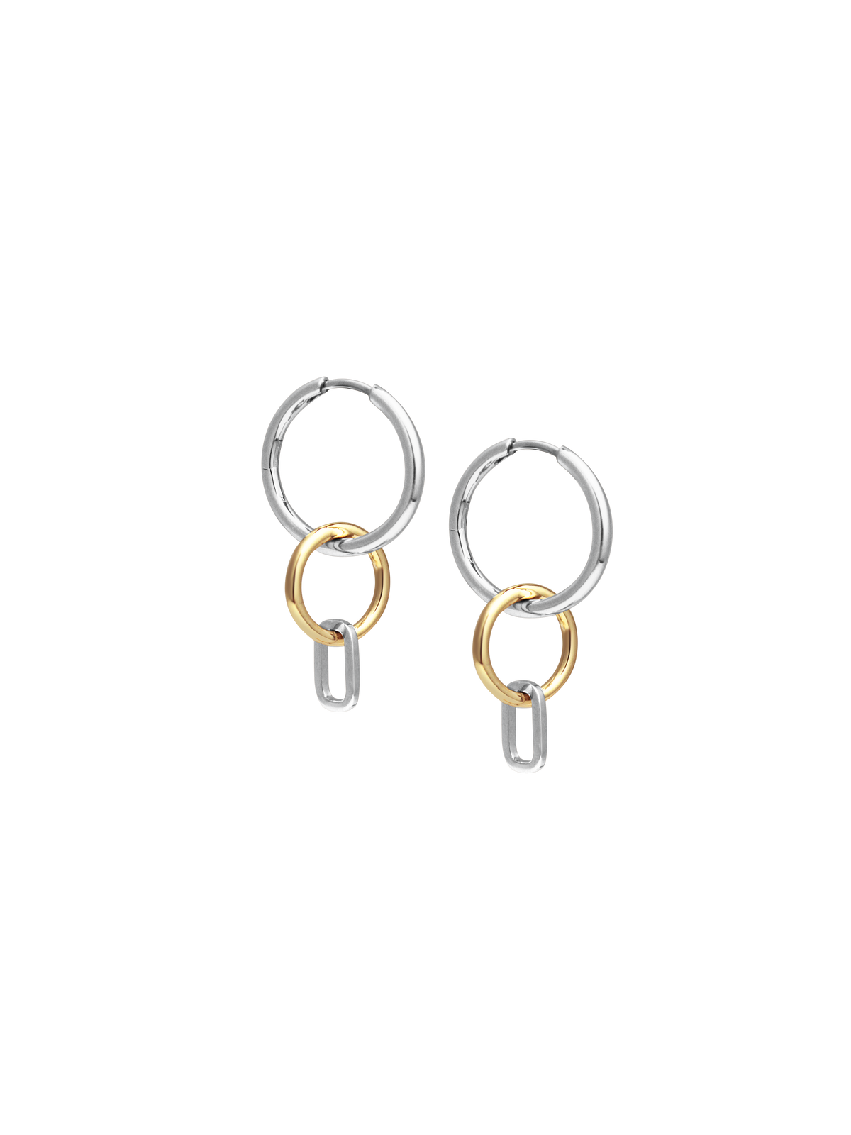 Side view of Laura Lombardi Two Tone Passa Earrings, medium silver hoops with a gold circular charm and a silver oval charm.
