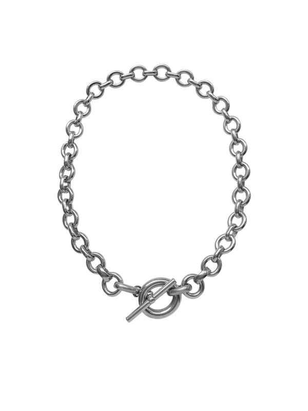 Silver chain necklace with a toggle clasp on a neutral background.